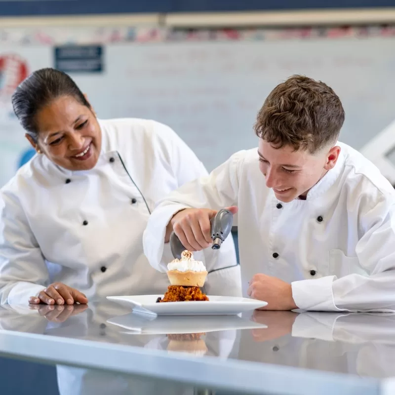 Pakuranga College student cooking in class