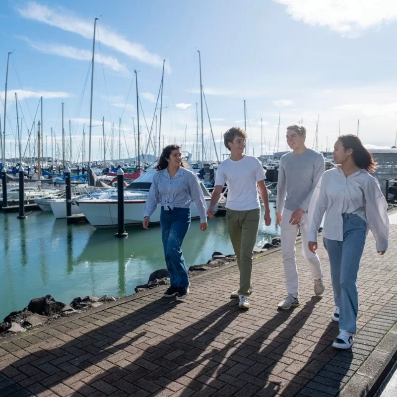 International students studying in Auckland - walking at the marina