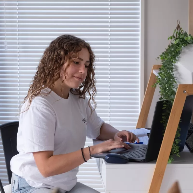 Important school information - an international student studying on a laptop