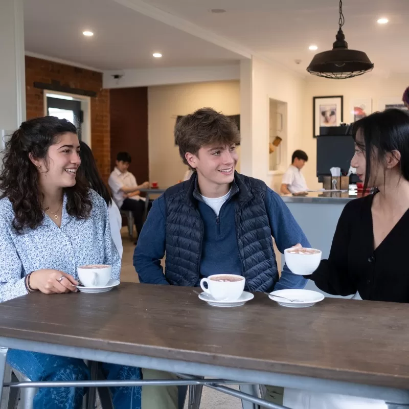 Homestay students drinking coffee at the Pakūranga College caf