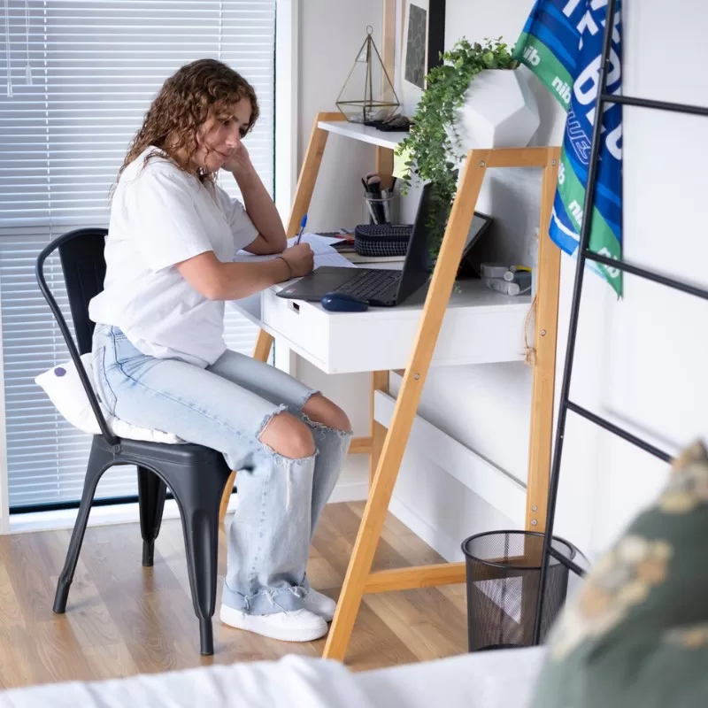International student studying in homestay room
