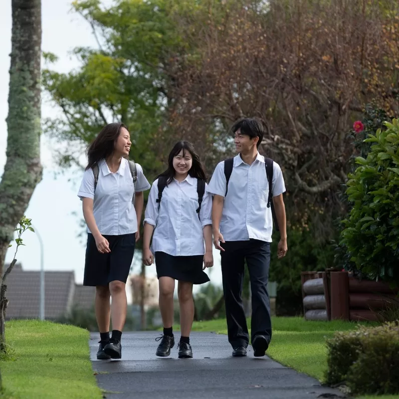 Homestay students in uniform walking to school
