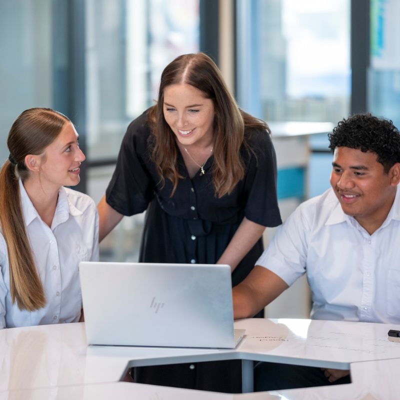 Student and teacher learning on a laptop at Pakūranga College
